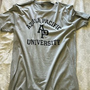 A medium sized shirt with the words, Azusa Pacific University on it.